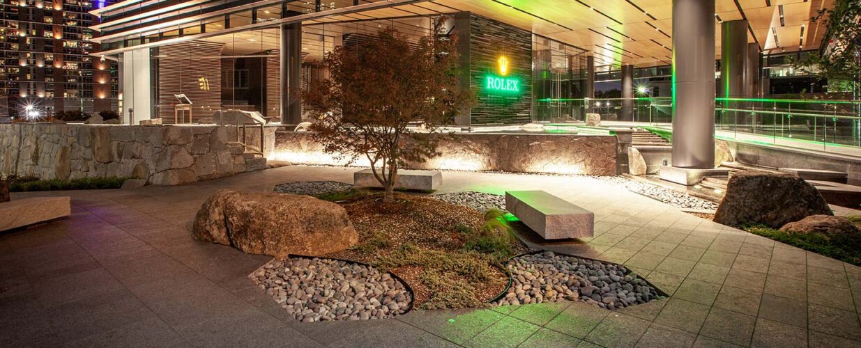 Rolex Plaza exterior landscaping at night